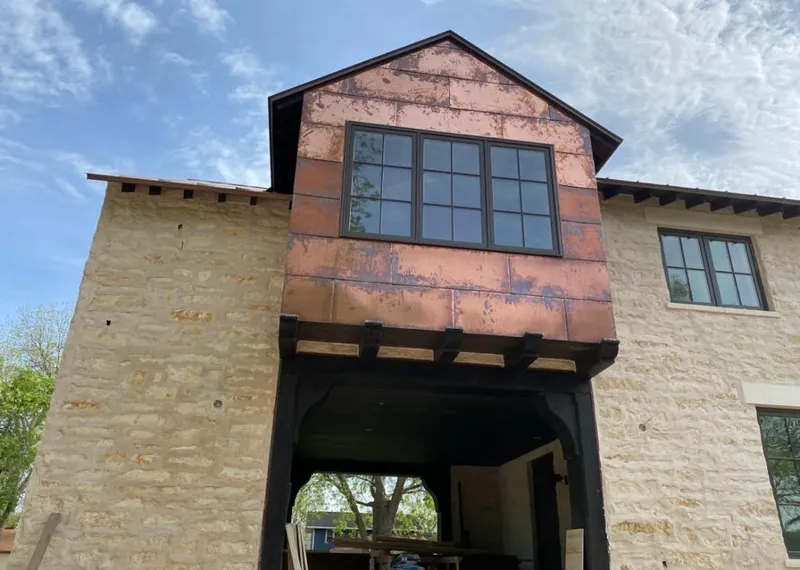 Copper metal panel facade on a stone building for Roof Repair in Hialeah Gardens