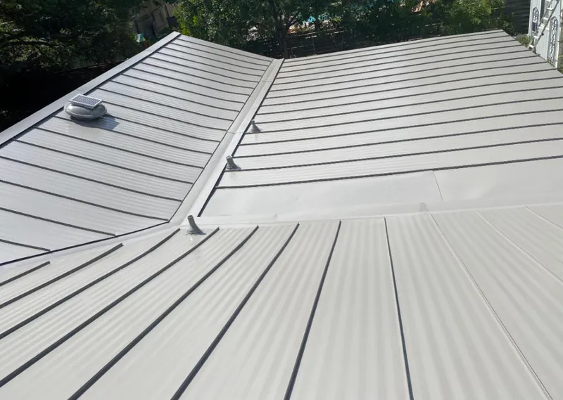 Solar attic fan installed on a metal roof for Roof Ventilation in Hialeah Gardens